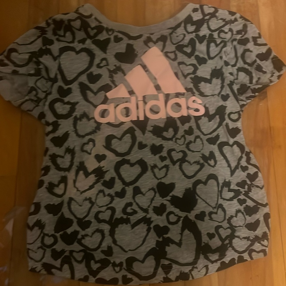 T shirt, black, grey and light pink. Size  8-12. Brand new.